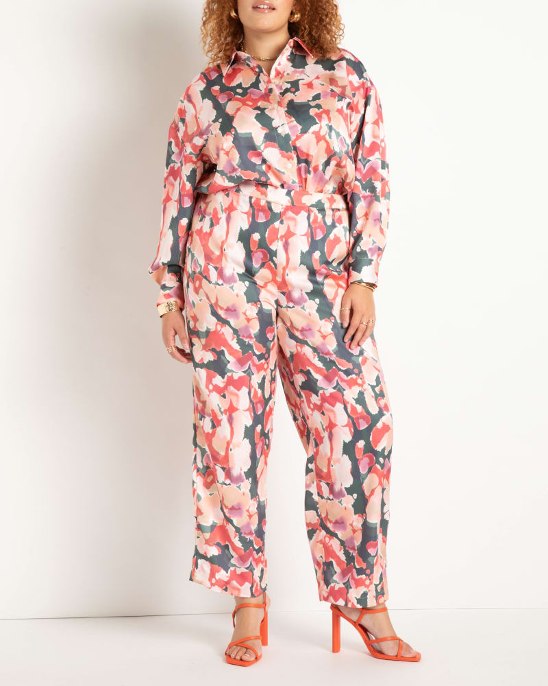 Front of a model wearing a size 14 Printed Satin Pajama Pant in Splash Of Spring by ELOQUII. | dia_product_style_image_id:272977